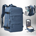 Un sac à dos bleu avec plusieurs poches zippées et boucles, avec des images des poches ouvertes pour montrer l'intérieur. — vue 1