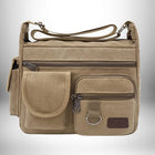 Le sac de ville homme est marron et a plusieurs compartiments et poches sur le devant. — vue 8