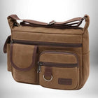 Sac de ville homme marron en toile avec plusieurs poches et une bandoulière.
— vue 7
