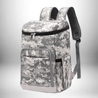 Un sac à dos glacière de style camouflage gris et blanc, avec une fermeture éclair noire sur le compartiment principal et une poche frontale avec le nom « GENIONISS » en bas.
— vue 1