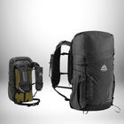Two backpacks are pictured, one on the left and one on the right. The one on the left is smaller with a green section. Both backpacks are tall and thin, likely for hiking or running. They appear to be lightweight, designed for the outdoors. "Backpack" is the keyword. — vue 2