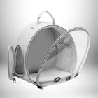 Image d'un sac à dos de transport pour lapin, ouvert, blanc et transparent, avec une poignée sur le dessus et une poche latérale zippée — vue 5