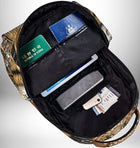 Vue de l'intérieur d'un sac a dos ethnique ouvert, contenant des documents de voyage : passeports, billets d'avion, et un appareil électronique — vue 5