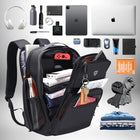 Image de présentation d'un **sac à dos professionnel homme** ouvert, montrant une variété d'objets : ordinateur portable, tablette, console de jeu, bouteille d'eau, vêtements, clés, parfum, écouteurs, appareil photo, souris, écharpes, bloc-notes, passeport et cosmétiques. — vue 3