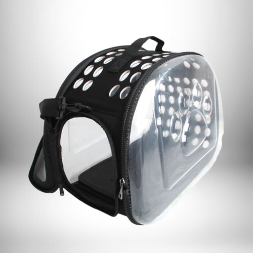 Image d'un sac à dos porte chat noir et transparent. Le sac a des trous ronds sur le dessus et une fenêtre transparente sur le côté pour que l'animal puisse voir. Il y a également une poignée de transport sur le dessus.