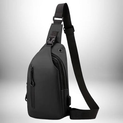 Voici une description textuelle de l'image :

Image d'un sac banane homme luxe sur fond blanc. Le sac est noir, avec une poche zippée sur le devant et une sangle réglable.