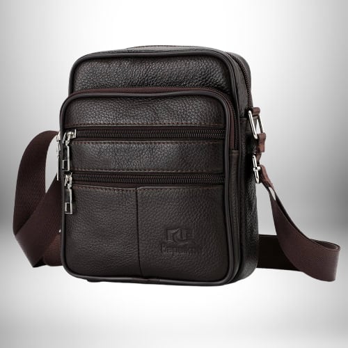 Un sac bandoulière cuir noir homme​ avec fermeture à glissière et plusieurs compartiments.