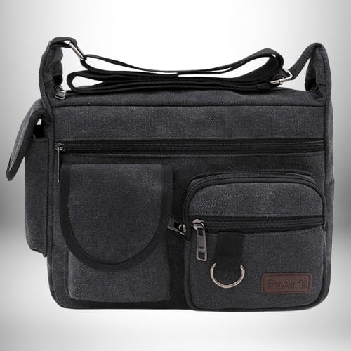 Un sac de ville homme en toile noire avec plusieurs poches et une bandoulière réglable.
