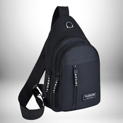 Un sac de sport bandoulière noir est en gros plan, avec une sangle épaisse, des fermetures à glissière et l'inscription « FASHION INSTINCT » en blanc.
