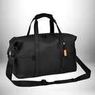 A black duffel bag with a shoulder strap and handles. The bag has an orange tag and a logo. — vue 2