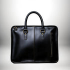 Un sac en cuir noir avec une poignée et une fermeture éclair. — vue 3