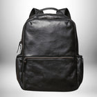 Un sac à dos en cuir noir avec de nombreuses coutures et poches. — vue 6